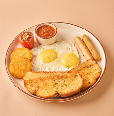 fried eggs and toast with sausages for restaurant menu 