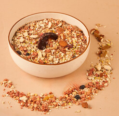 A bowl of oats mixed with crunchy nuts and the natural sweetness of dates for a nourishing bite
