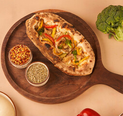 crispy garlic base bread topped with mozzarella fresh vegetables 