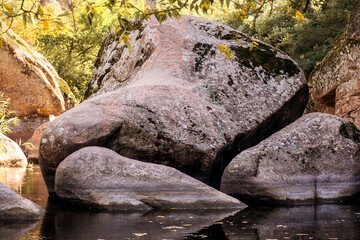 Beautiful blue lake with boulder figures