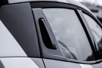 Naklejka premium Close up car exterior. Modern car tailgate handle