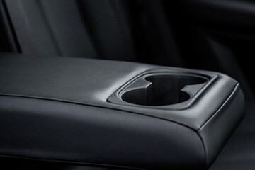 Cars passenger back rear seats armrest in black color with cup holders