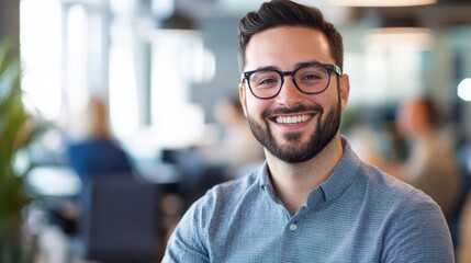 Obraz premium A man with a beard and glasses smiling.