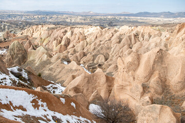 Rock formations of the Red Valley (Valley of Roses), Cappadocia, Turkey , in winter.