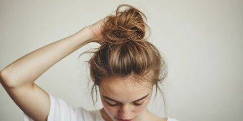 Fototapeta premium Casual Hairstyle A Stylish High Bun That Effortlessly Exudes Both Elegance and Charm