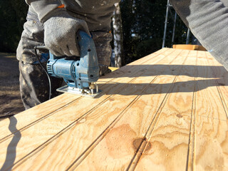 Crafting elegance in wood with precision at a sunny outdoor workshop