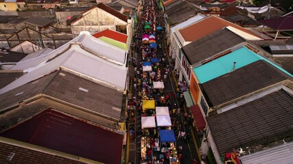 Crowds walking through busy street market in georgetown, penang, malaysia