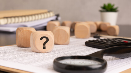 Question Mark Concept Wooden Cube with Symbol of Uncertainty and Inquiry