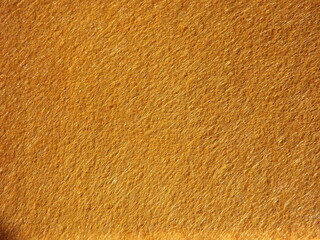 The textured surface is brown, red in color as a background. Felt. High quality photo