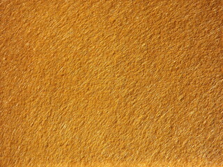 The textured surface is brown, red in color as a background. Felt. High quality photo