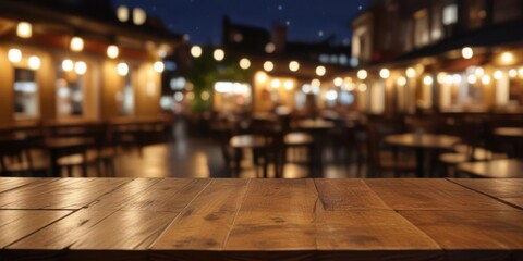 Empty wooden table top with blurred light gold bokeh of cafe background in dark setting,  decor,  ambiance
