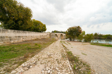 Seljuk bridge in Aspendos. The Eurymedon Bridge. Aspendos Yolu Belkis Mevkii. Turkey. Crooked bridge. Bridge over the Koprucay (Euremedon) River near Aspendos, in Pamphylia, in southern Anatolia 