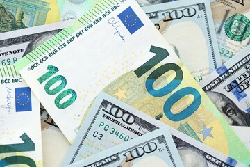 Big pile of Euro and USD banknotes. Many european and united states dollars