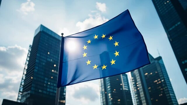 Flag of European Union waving in the wind in front of the modern buildings on sunny day. Europe Day. European Parliament elections, European Union Summits, G20 Summit. Future of Europe