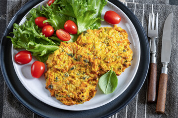 pumpkin carrot potato patties on plate, top view