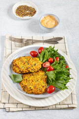 pumpkin carrot potato patties on plate, top view
