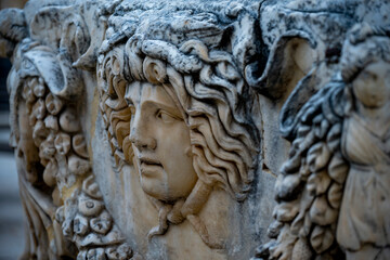 Statues, sarcophagi and other artifacts from the ancient city of Perge are exhibited in the Antalya Museum. Rows of columns in Perge, Antalya, Turkey. Remains of colonnaded street in Pamphylian ancien
