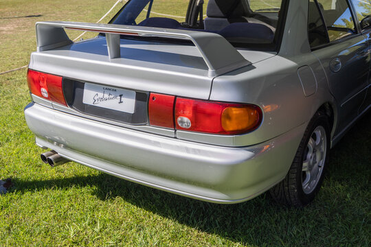 Mitsubishi lancer evolution i rear view parked on grass