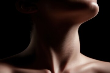Close-up of a woman's neck, soft lighting