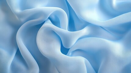 Obraz premium Close-up of soft cotton fabric with delicate folds, pastel blue background.