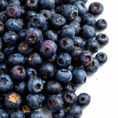 Fresh Blueberries Piled Together Showcasing Their Dark Blue Color With A Hint Of Purple On An Isolated Background