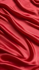 Obraz premium Closeup of rich red satin fabric, elegantly draped, showcasing its smooth texture and luxurious sheen. The folds create a sense of depth and movement.
