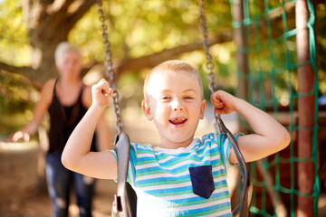 Swing, push and portrait of boy with mom, outdoor adventure and development for kids in park. Play, mother and happy child in playground for growth, fun games or childhood bonding on summer weekend