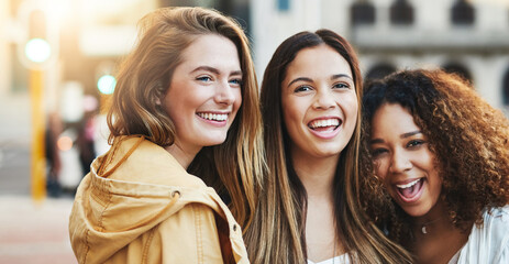 Women, laughing and outdoor hug in town, holiday travel and bonding together for friendship. People, support and trip on street of urban city for connection, funny conversation and happy girlfriends