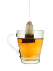 Brewing aromatic tea. Cup with teabag isolated on white