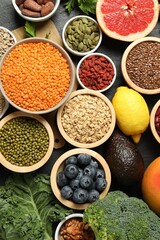 Superfood. Different healthy food products on grey table, flat lay