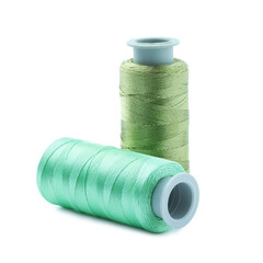 Spools of colorful sewing threads isolated on white