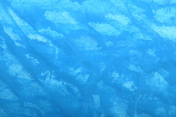 simple background in blue with brush strokes and scratches
