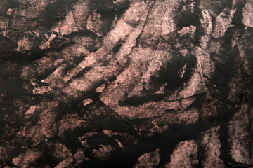 simple background of black stains on pink paper
