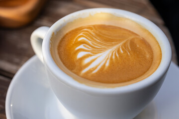 Elegant Cappuccino with Latte Art in White Cup