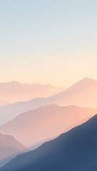 Serene landscape of mountains at sunrise with gentle atmospheric hues, perfect for phone wallpaper or background