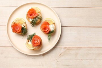 Tasty tartlets with delicious filling on wooden table, top view. Space for text