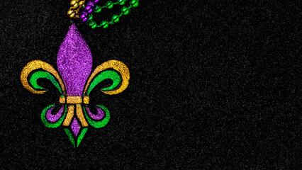 Mardi Gras beads with Fleur de lis, in glittering green, purple, and gold. Sparkling festive background for Mardi Gra in traditional colors. © Leigh Prather