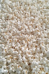 A large pile of freshly popped popcorn