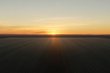 A beautiful sunset over a vast, empty field