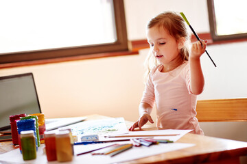 Creative, art and child painting in home for elementary school project, homework or assignment. Equipment, activity and girl kid creating picture for fine motor skills, imagination and development.
