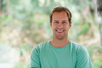 Home, smile and man in portrait with confidence for holiday, weekend off and relax in by window....