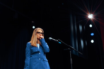Woman clears her Throat before Giving a Public Speech. Anxious person delivering a speech having a...