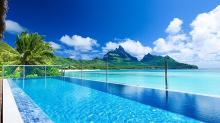 Obraz premium Serene tropical landscape featuring a stunning infinity pool overlooking a crystal-clear lagoon and mountains