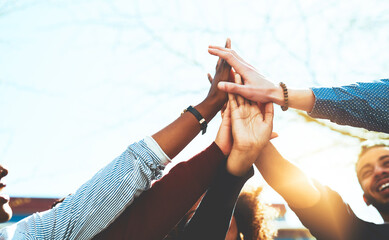 Obraz premium Students success, hands or high five on outdoor campus for achievement or college scholarship in university. School, teamwork or people with learning goal or help for passing exam or test results