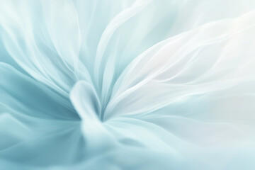 Obraz premium A soft, blurred image of a cloudy sky in pale blue and white tones. The calming and serene background is ideal for nature-inspired or wellness designs 