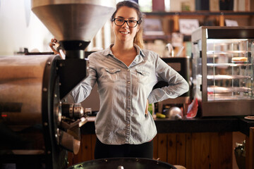 Coffee machine, portrait and smile with barista woman in kitchen of cafe for brewing or hospitality. Equipment, roast and service with happy waitress in restaurant for sale of fresh beverage