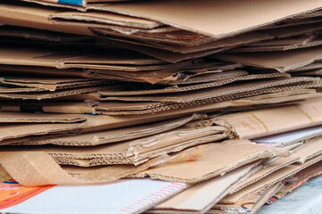 close up of a pile of folded used cardboard