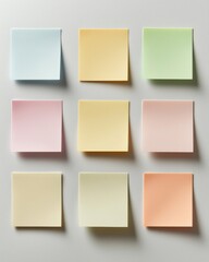 A grid of pastel-colored sticky notes arranged neatly on a light background, showcasing a variety of soft hues in a minimalist style.