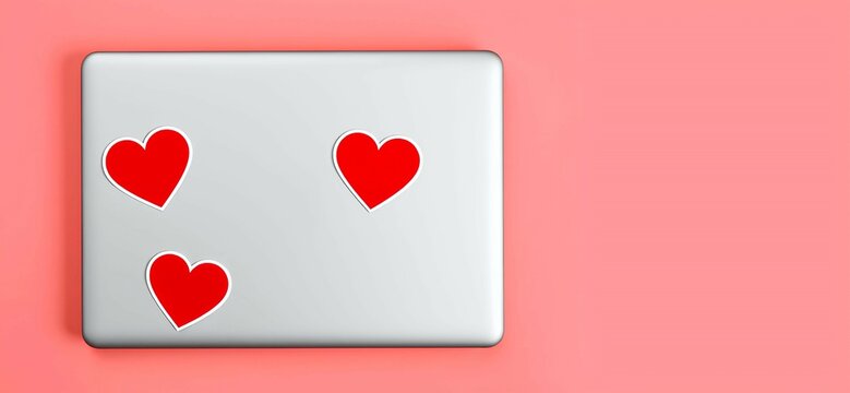 Cute red heart shape sticker mockups are attached on a laptop with pink background
