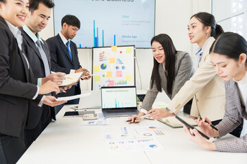 Asian business group meeting to give advice on graphing and document work in the office
